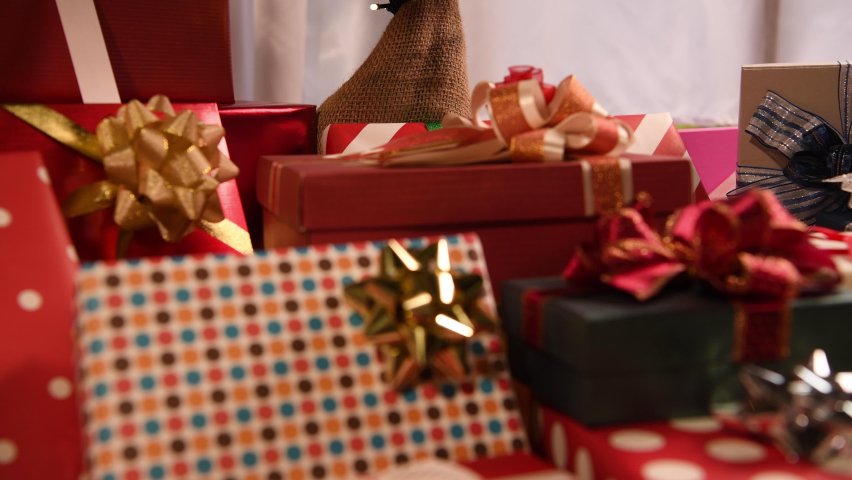 Holiday gifts under the christmas tree. Royalty-Free Stock Footage #1059725963