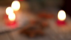 Winter ornamental decoration with burning candles on wooden rustic table in 4K VIDEO. Mulled wine punch with gingerbread in foreground. Christmas holidays and New Year theme. Close-up. - Powered by Shutterstock - Get 15% off with code: PIKWIZARD15