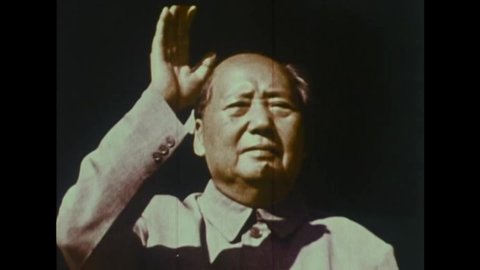CIRCA 1970s - Party Workers screen a film of Mao Zedong and his supporters for Chinese peasants, in China, in 1972.