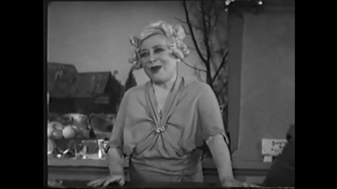 CIRCA 1935 - In this comedy film, the proprietress of a low-class restaurant performs a routine for her patrons.