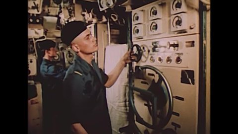 CIRCA 1971 - In this Soviet propaganda film, sailors are seen working on a submarine.