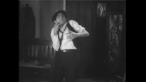 CIRCA 1934 - In this horror film, a man turned crazy by a doctor attacks women and the doctor himself.