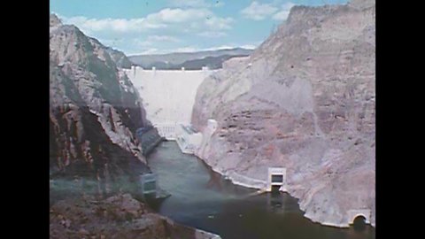 CIRCA 1950s - Hoover Dam is shown and an animation details the flow of water through the hydroelectric system, on the Border of Nevada and Arizona.