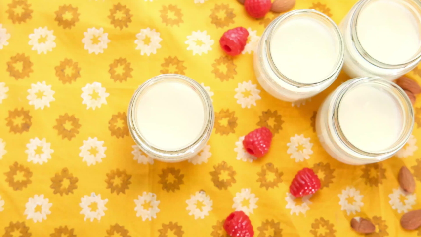 top view of person hand eating fresh yogurt 