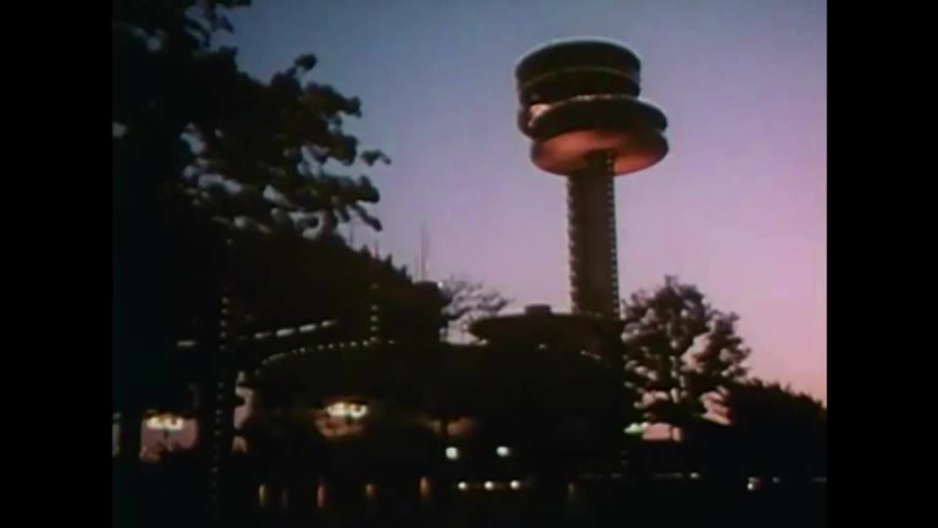 CIRCA 1960s - As nighttime comes to the 1964 New York World's Fair, pavilions are lit up beautifully for the dark.