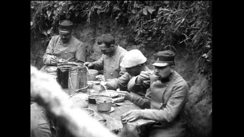 CIRCA 1910s - Soldiers in trenches eating, manning a telephone station and keeping watch are shown during World War 1, in 1917.