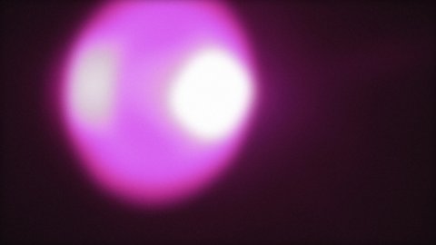 A big defocused light crossing the screen in the darkness. Short quick movement in two different versions (dark, glowing).

