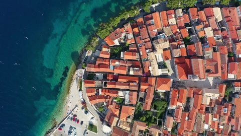Overhead aerial drone footage on the Korcula medieval old town by the Adriatic sea in Croatia in the Balkans