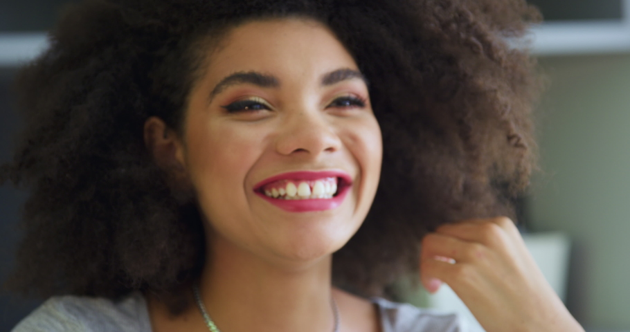 Young woman smiling and talking / Claremont, Cape Town, South Africa