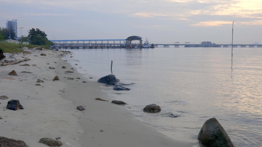 Beach and marina looking over the Penang Bridge on the edge of Georgetown, Malaysia.