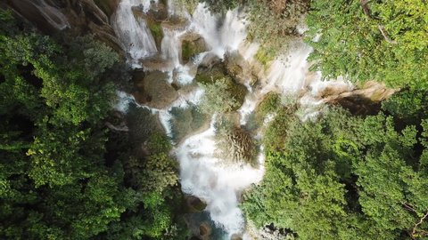 Idyllic Waterfalls Deep in Jungle Top Down Birdseye Ascending Aerial. Laos Asia, Kuang Si Falls