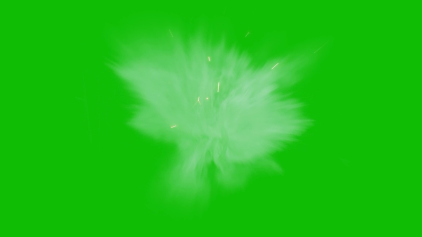 Dusty bullet hits on a wall with chunks of debris flying out . Powder explosion on green screen background.Impact dust particles. Dust explosion in front of black background, slow-motion close up. VFX