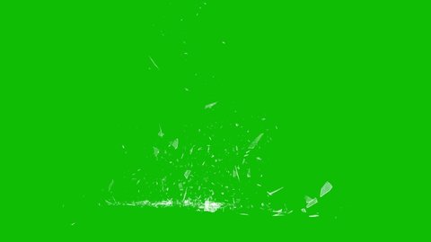 Shattered and broken glass shards flying through the air after crush broken window on a green screen background