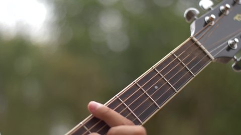 Closeup of guitar strings and hands Adlı Stok Video