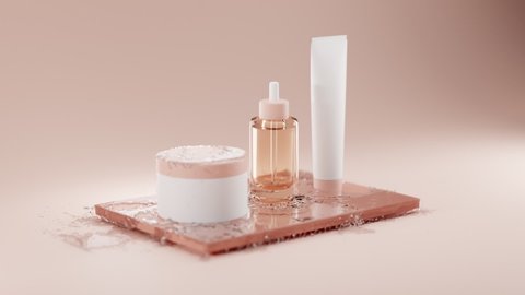 Collection of transparent glass bottle with dropper for liquid medicine and two white blank cosmetic plastic cans on wooden tray in cold water splash on beige background. Skin care for face and body