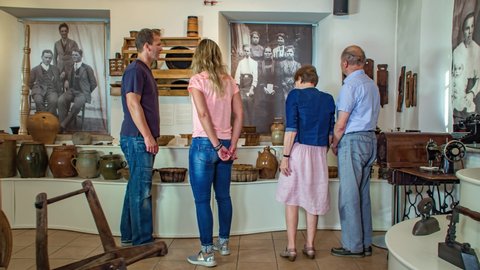 Crna na Koroskem / Slovenia - 09 05 2019: Older and younger couple at museum, Crna na Koroskem, Slovenia, slowmo