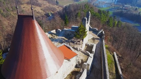 Aerial drone shot flying over Zovnek castle in Braslovce, Slovenia