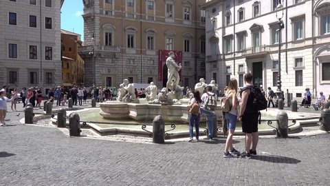 Rome, Piazza Navona, Fontana del Moro, people sightseeing. Rome Italy May 2019