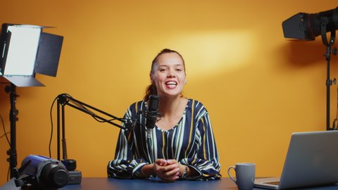 New media star talking to the camera and recording a new episode of her show. Content creator influencer on social media recording for internet web online subscribers audience new podcast with