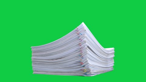 Stop motion animation Stacks overload document paper files on chroma key green screen background. Alpha Channel.