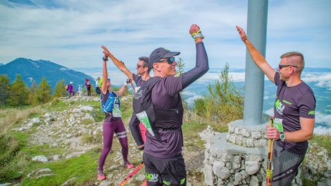 Mount St Ursula / Slovenia - 09 29 2019: Ultra Marathon Runners Celebrate By High Five Together After Climbing To The Peak Of Mount St Ursula in Slovenia