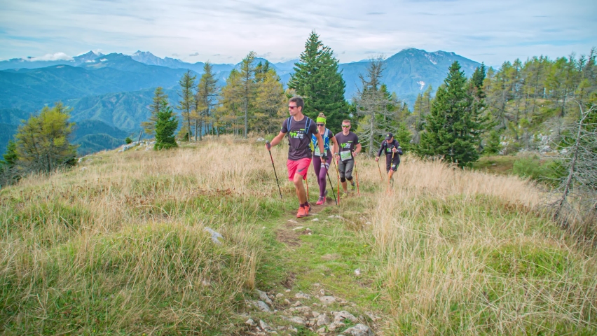 Urslja Gora / Slovenia - 09 29 2019: active group of long distance ultra trail runners making the way throw the hills | Shutterstock HD Video #1059807014