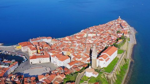 Peninsula town of Piran, seascape and historic buildings. Aerial view