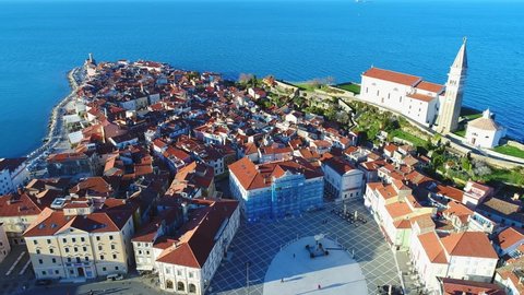 Birds eye view showing medieval architecture of Piran town at Adriatic sea, with narrow streets and compact houses. Slovenia. Aerial.