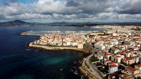 drone shooting of the city of Alghero with beautiful light and a scenic sky