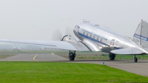 LELYSTAD, THE NETHERLANDS - JULY 7, 2017: Vintage Douglas DC-3 propellor airplane ready for take off at the runway of an airfield.
