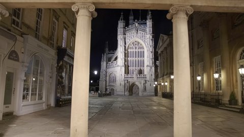 BATH, circa 2020 - Night walk towards the Bath Abbey, in Somerset, England, UK, founded in 675 AD with its stunning sculptures of angels climbing to heaven