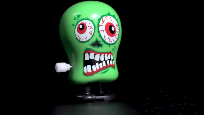 Mechanical wind-up toy monster walking, kitsch, halloween, wind up toy  | Shutterstock HD Video #1059827654