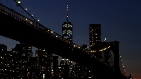 Beautiful Brooklyn bridge over Manhattan midtown with lights seen New York City NY USA