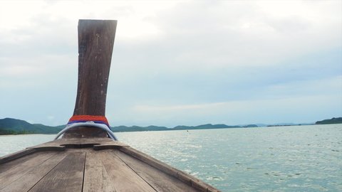 Head of local wooden long tail boat heading to Yao Yai Island, Phuket, thailand with copy space.