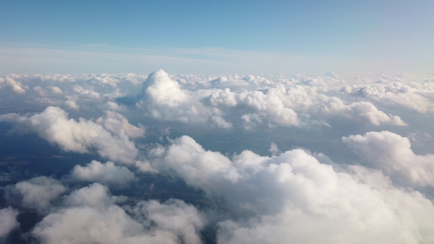 Airplane flight. Flying above the clouds. View from the window of the plane. Traveling by air Royalty-Free Stock Footage #1059834794