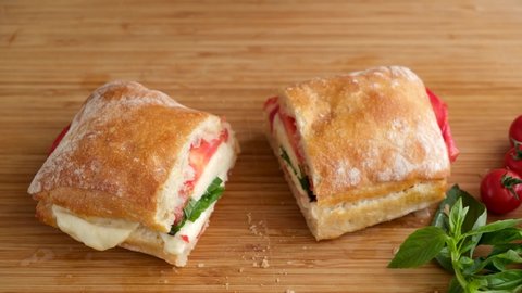 Caprese sandwich, toasted ciabatta bread with mozzarella cheese, tomatoes and basil