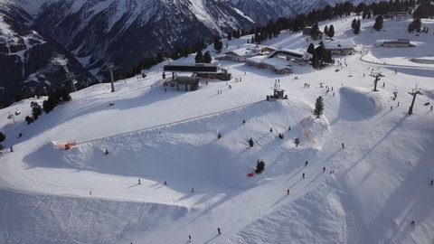 Aerial view of skiers on ski slopes in Penken area, Mayrhofen ski, Tyrol, Austria.