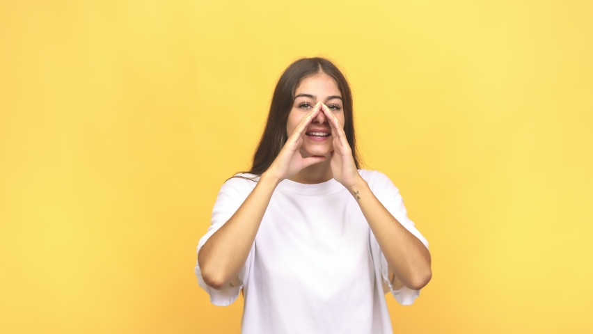 Young caucasian woman shouting excited to front | Shutterstock HD Video #1059850304