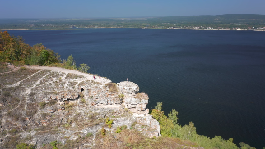 Hikers on the rock. Group of hikers stand on top of the rock ( Camel Rock) and enjoy the view. Zhiguli Mountains in Russia