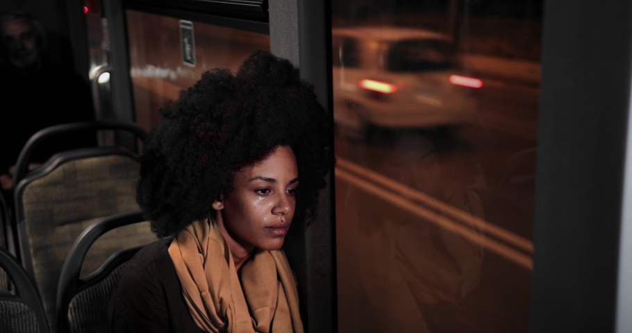 Sad african-american woman sitting on public bus crying wiping tears Royalty-Free Stock Footage #1059858041