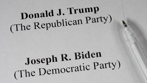 KYIV,UKRAINE-SEPTEMBER 10,2020: Candidates of Democratic Party Joe Biden and Republican Party Donald Trump. Paper ballot and blue pen on november 3, 2020 US Elections