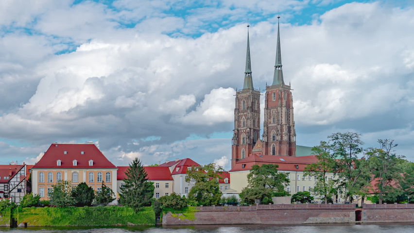 Time Lapse of Historic Cathedral of St. John the Baptist in Wroclaw, Poland. Beautiful Timelapse at Tumski island in Sunny Day, Odra river, 2020.