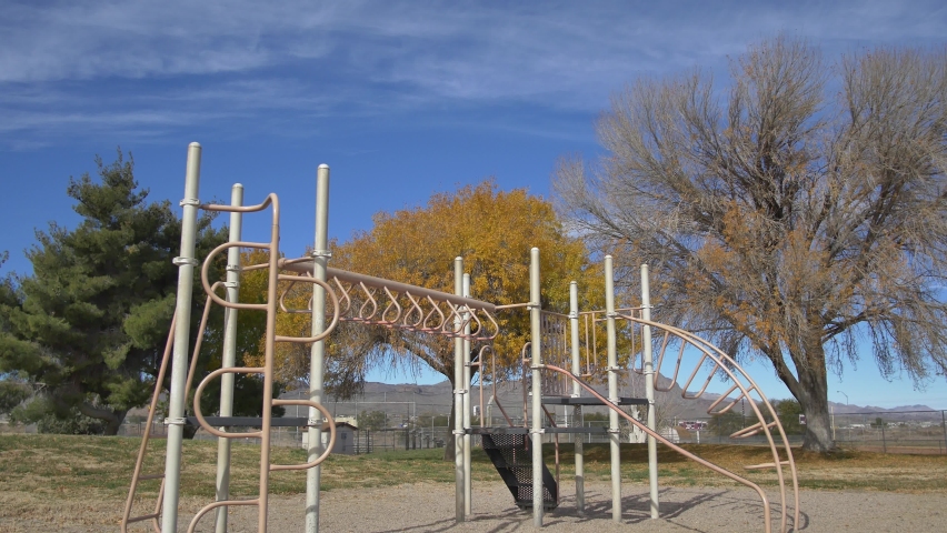 Static shot of an empty playground in the fall