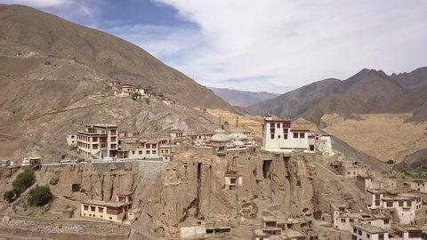 Lamayuru Monastery And Village On The Steep Mountain Slope Of Moonland In Leh, Ladakh, India. - aerial pullback shot