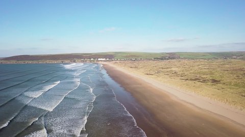 Reveals Stunning Beauty Of Nature On The Shoreline Of Saunton Sands Beach During Summer In North Devon, England. - Aerial Drone Shot