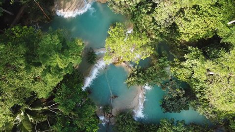 Hidden Natural Pools With Turquoise Water Deep in Rainforest, Ascending Birdseye Aerial View. Kuang Si Falls, Laos