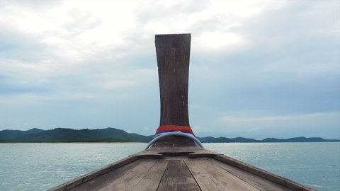 Head of local wooden long tail boat heading to Yao Yai Island, Phuket, thailand.