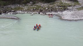 Video filming from a drone, the beautiful mountain river Argut and athletes rafters on a catamaran chase ashore. Altai mountains and clean air. Altai Republic, Russia.