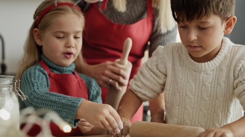Handheld video of children making gingerbread pastry. Shot with RED helium camera in 8K.