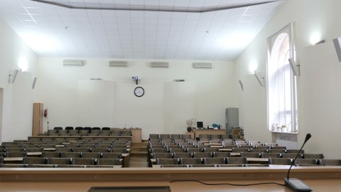 View from the presidium table to an empty large auditorium, lecture hall, assembly hall, conference hall